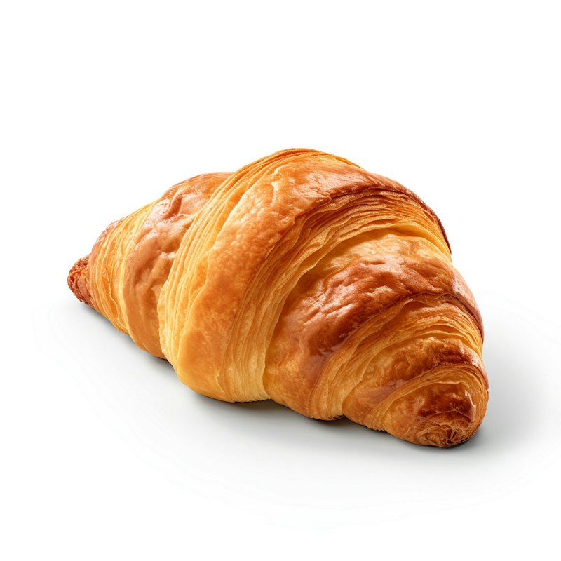 A golden, flaky croissant on a white table