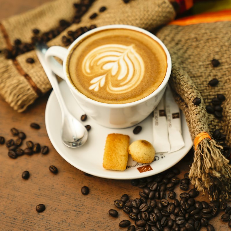 A cup of coffee on a white saucer